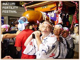 Mark Schumacher carrying "mikoshi" or portable shrine at Fertility Festival in Inatori, Japan