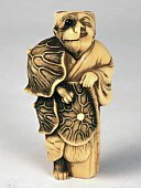 Netsuke. Ivory. Tanuki transforing into monk. https://picasaweb.google.com/100568504365200477176/Netsuke?