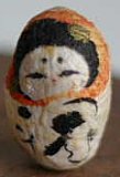 Mayu Daruma (Gestation Kami). This doll is made of silk.