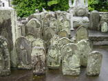 Stone carvings including Nyo-irin Kannon, at Zenyo-in in Inatori City