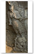 Near Binyang Middle Caves. 500-523 AD. Heavenly king atop evil creature.