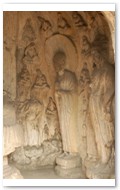 Near Binyang Middle Caves. Wall scene, carved between 500 to 523 AD.