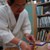 4. Mukoyoshi assembling his Aizen Myo-o statue, decorated with kirikane (gold foil) by his wife.