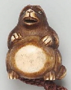 Netsuke in the form of a tanuki drumming on its belly. Japanese, Meiji Era, Late 19th century. MFA Collection.
