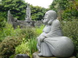 Hotei - stone statue at Zenyo-in in Inatori City