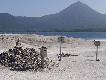 Jizo surrounded by prayer stone at Sainokawara, Osorezan. Photo courtesy Ellen Schattschneider