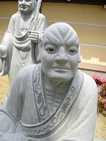 Stone Rakan statues outside Zentsuji Temple