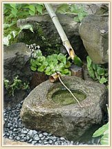 Purification font in garden of sake brewery Daimon Shuzo (Osaka)