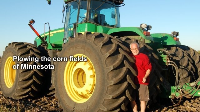 Mark in Minnesota in front of a giant tractor with 26 discs for tilling the earth