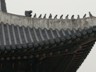 Roof tiles at Gyeongbokgung Palace, Seoul, Korea. The protective rooftop effigies come in various configurations, including groups of three, five, six, seven, and eleven, and meant to protect against fire.