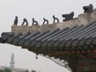 Roof tiles at Gyeongbokgung Palace, Seoul, Korea. The protective rooftop effigies come in various configurations, including groups of three, five, six, seven, and eleven, and meant to protect against fire.