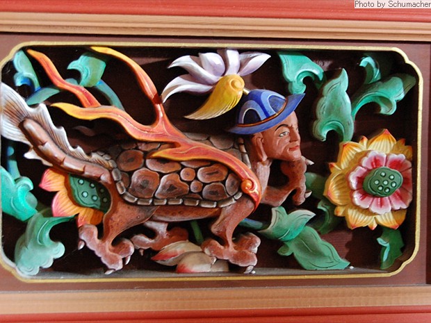 Panel carving at Chukseosa Temple. Depicts a dragon-like turtle-like creature with a human head. If you can identify this deity, please contact me by clicking above image.