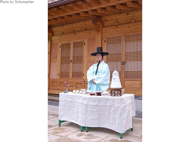 DOOR. Man serving refreshments at the Asian Art Museum, Seoul, Korea.