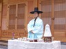 DOOR. Man serving refreshments at the Asian Art Museum, Seoul, Korea.