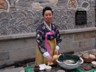 Lady serving refreshments at the Asian Art Museum, Seoul, Korea.